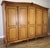 This impressive vintage French Louis style wardrobe makes a striking statement with its grand proportions, elegant five-...