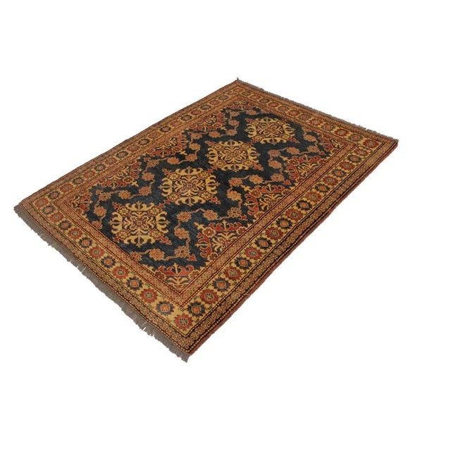 Embellish your home with this exquisitely hand-knotted super kazak rug made with the finest hand spun wool and all...