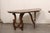 An Italian pair of carved wood demi console table from the 19th century. These antique tables from Italy each feature a...