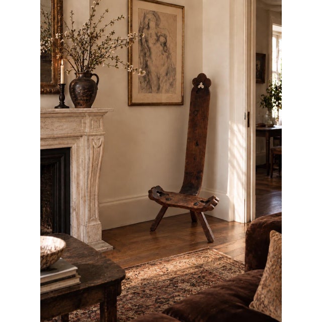 A wonderfully unusual vintage primitive birthing-style chair, handcrafted in solid wood with an exceptionally tall,...