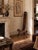 A wonderfully unusual vintage primitive birthing-style chair, handcrafted in solid wood with an exceptionally tall,...