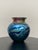 Hand-blown studio art glass vase by Lundberg Studios of California, executed in a rounded bulbous form with a flared rim...