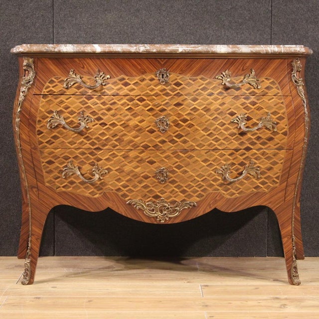 French chest of drawers from the second half of the 20th century. Furniture pleasantly inlaid with geometric decoration in...