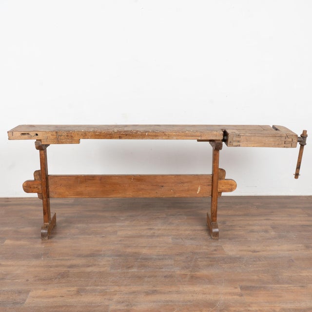 The worn patina of this old carpenter's workbench is a reflection of its age and years of use. Every ding, scratch, crack,...