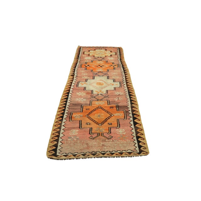Decorative handwoven vintage kilim rug from Kars region of Turkey. Approximately 50-60 years old. In very good condition.