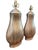 A sculptural pair of ceramic table lamps by Wildwood, featuring elegant vertical striations and a softly reflective...