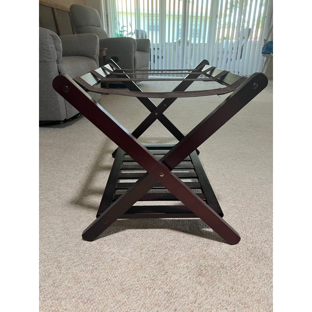 Dark Brown wood Folding Luggage Rack. Measures 19.5” x 26.5” x19.5” Folded measures 19.5” x26.5” x3”