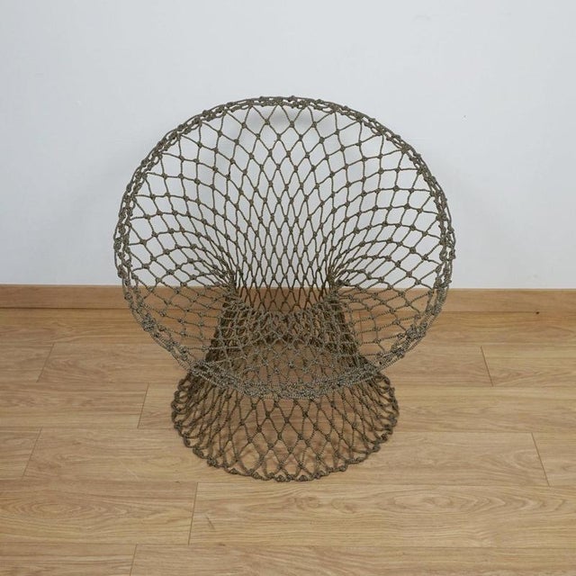 Fishnet chair' by marcel wanders. 'fishnet chair is hand-knotted f rom a braided fibre cord wrapped around a carbon fibre...