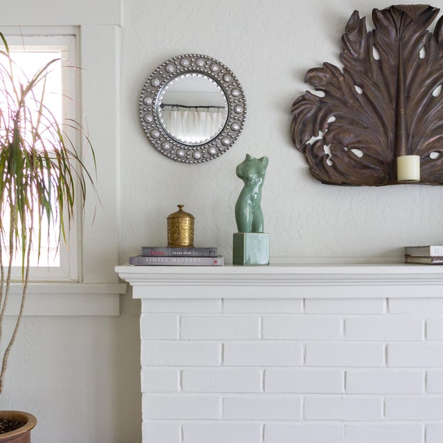 A lovely ceramic nude female sculpture on a plinth in a soft sage green glaze. '15-H' and '12-LC' are carved into the...