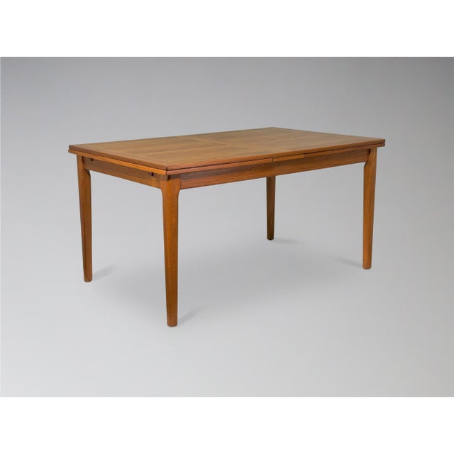 Fully restored vintage Danish teak expanding dining table w/ 2 large leaves produced by Dyrlund c.1970. A rare version of...