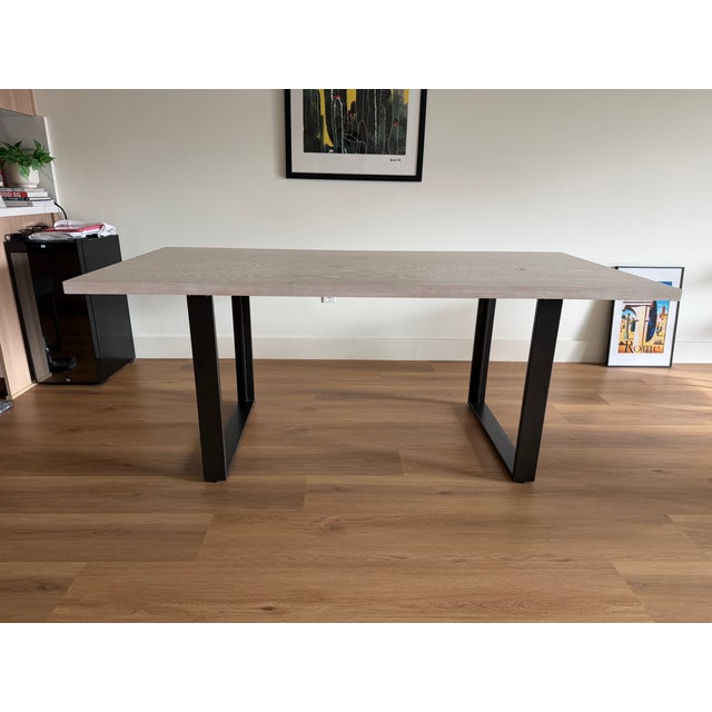 West Elm Tompkins 74-inch Industrial Dining Table in Winter Wood with Antique Bronze steel legs. The light wood finish and...