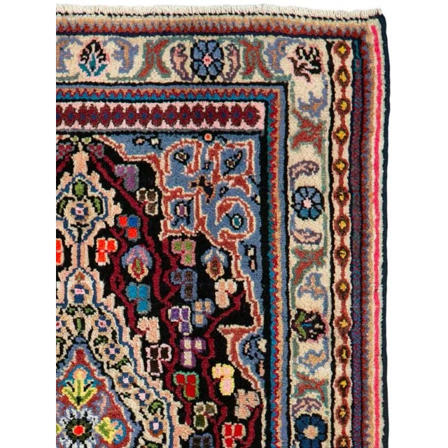 A vintage Persian hamadan rug from the mid-20th century. Hamadan town and the surrounding weaving area of about 120...