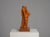 An expressive hand-carved sculpture by dutch artist h. Hinfelaar, created from pearwood. The elongated organic form...