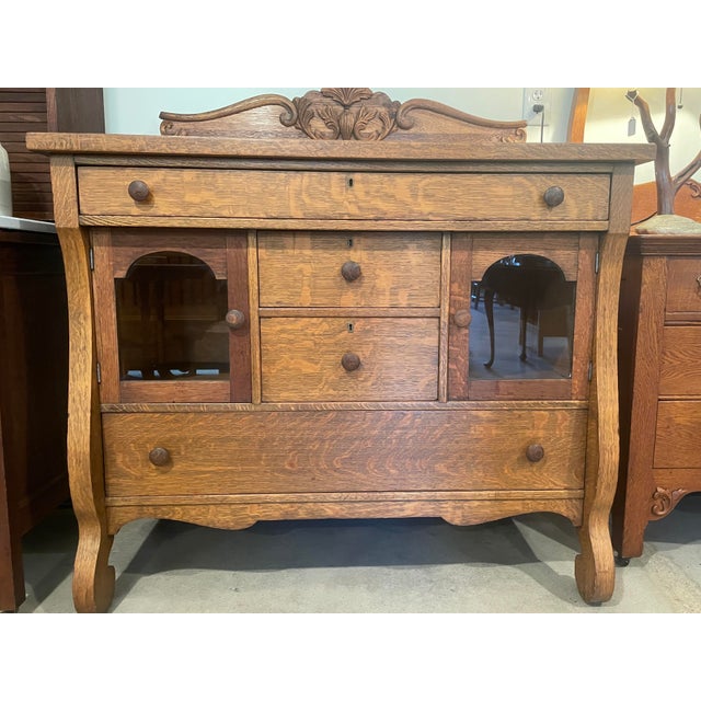 Beautiful Antique American Empire Revival Style Sideboard/Buffet. Crafted in a gorgeous dramatic tiger oak grain pattern...