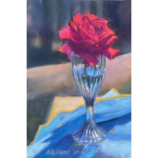 Rose in Flute by Bruce A Gómez | Pastel of a red rose in a glass vase on a blue tablecloth For Sale