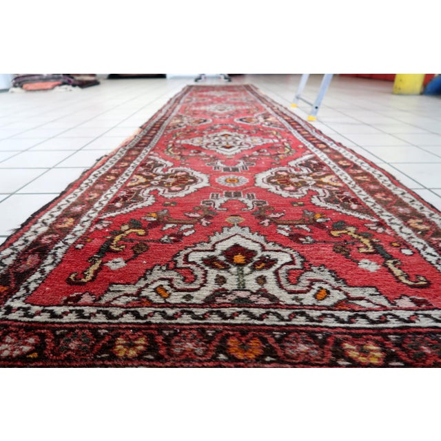 A Rare Tribal Runner from North‑West Persia This handmade antique Persian Malayer runner rug was woven in the Malayer...