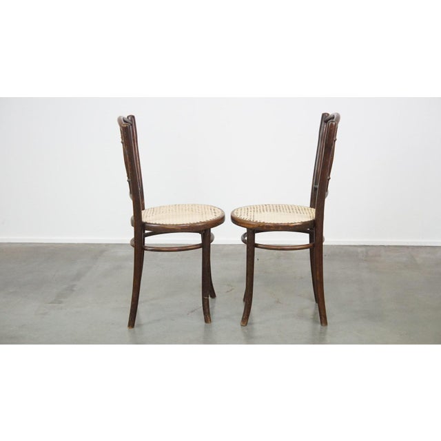 We are offering this set of two original vintage Thonet bistro design chairs. These wonderful chairs are made of a curved...