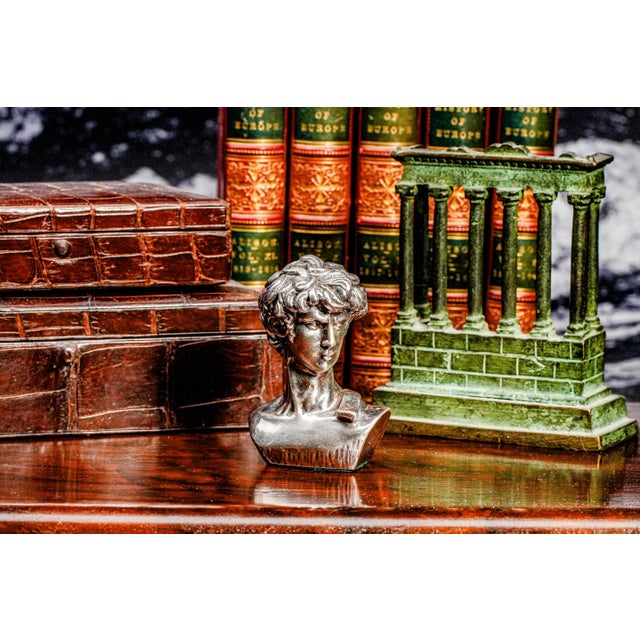 A striking homage to one of the most iconic works of art in history, this miniature bust of Michelangelo’s David captures...