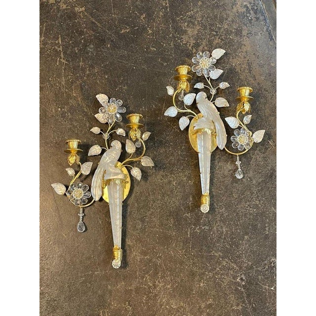 A beautiful pair of Italian gilt metal and rock crystal sconces, after Maison Bagues. Circa 2000. A stunning addition to...