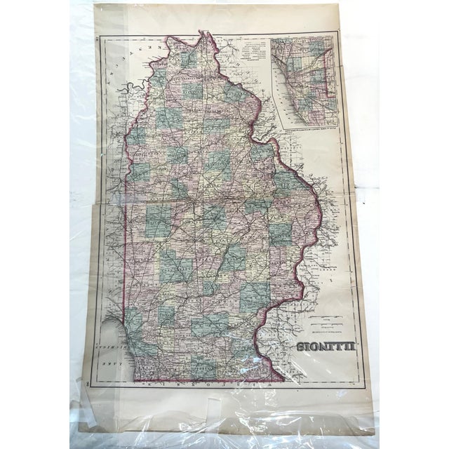 This remarkable 32" x 20" antique two-sided map offers a dual historical perspective: one side features a detailed plan of...