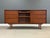 A mid century modern teak sideboard credenza with a tambour sliding door made by Danflex Systems. Made in Denmark. Circa...