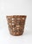 A vintage handmade basket combining woven wicker with natural birch bark bands, giving the piece a richly textured surface...