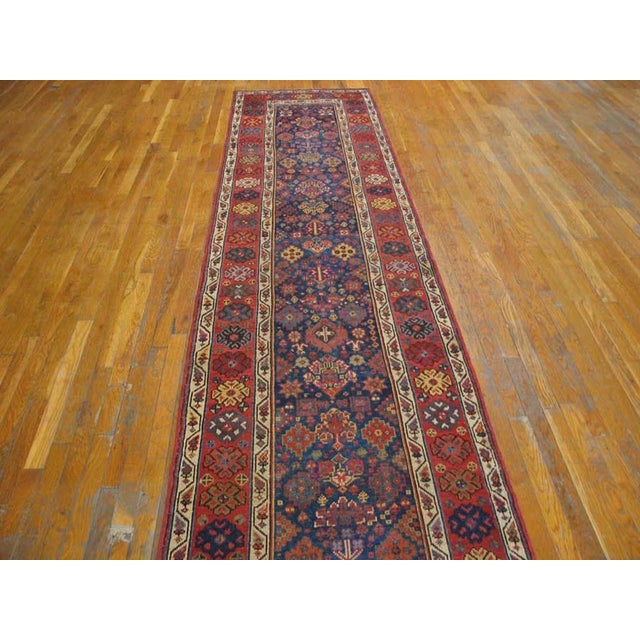 19th Century W. Persian Kurdish Carpet ( 3' x 14' - 90 x 427 ) The royal blue ground of this c. 1890 long piece has a...