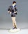 Excellent art ceramic figurine from the 1930s: young lady with bob hairstyle standing upright, torso turned to the left...