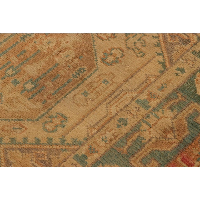 Made with hand-knotted wool and originating from Turkey circa 1890-1900, this 3x6 antique runner rug is an especially rare...