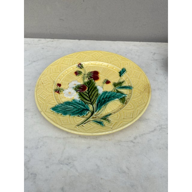 Fine Majolica strawberries on yellow geometrical background signed Sarreguemines, circa 1880.