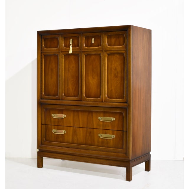 There are highboys, and then there are statements. This 1970s Campaign style highboy by Henry M. Goodman Furniture is the...
