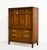 There are highboys, and then there are statements. This 1970s Campaign style highboy by Henry M. Goodman Furniture is the...