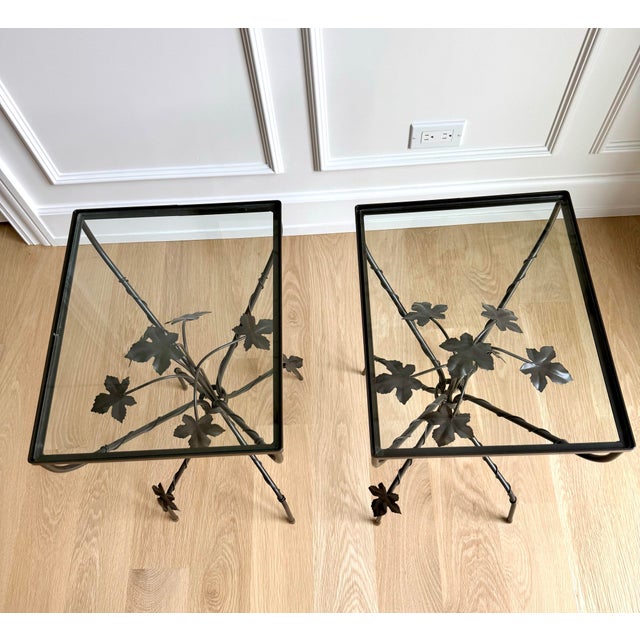An exceptionally beautiful pair of vintage wrought-iron side tables by Scully & Scully. Their wonderfully sculptural bases...