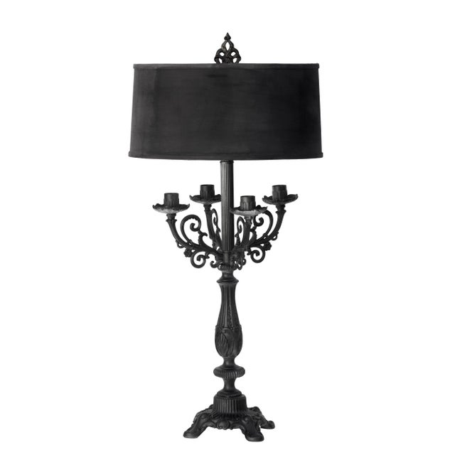 A hand painted table lamp that has four branch candelabras with a standard bulb in the center. Repousse metal, with a...