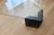 Haziza Style Modern Black Acrylic Coffee Table. The 1/2" thick glass has two regular corners that fit into the base pieces...