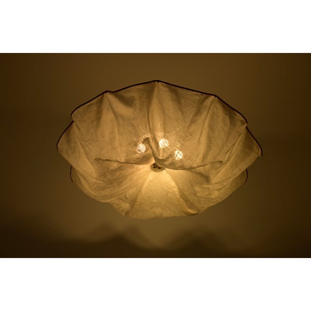 Ceiling light in white linen canvas and aluminum. Celestia model. Stamped Flos. Wear due to time and age. This piece has...