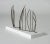 Iron sculpture with a rusted finish by Fred Leyman, mounted on a wooden base. The iron strands bring grass blowing in the...