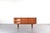 This teak sideboard was manufactured in Denmark in the 1960s. The piece of furniture has four drawers and a sliding,...