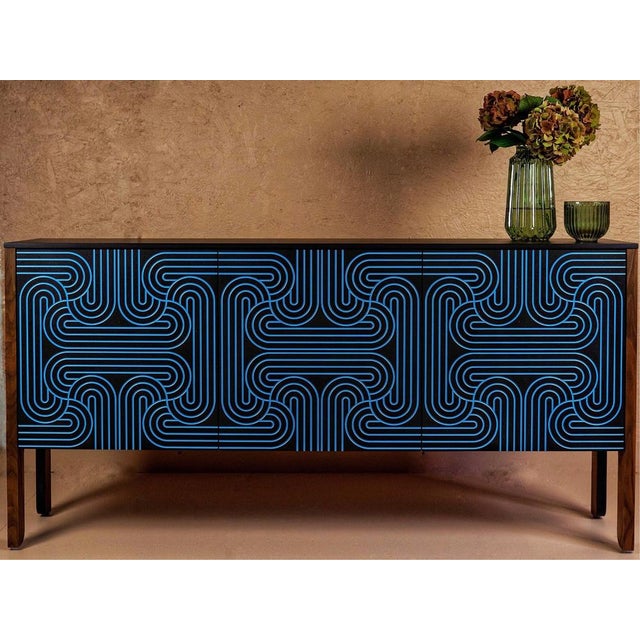 The loop sideboard three door with emerald, black, blue or red doors. This piece will add a contemporary art deco elegance...
