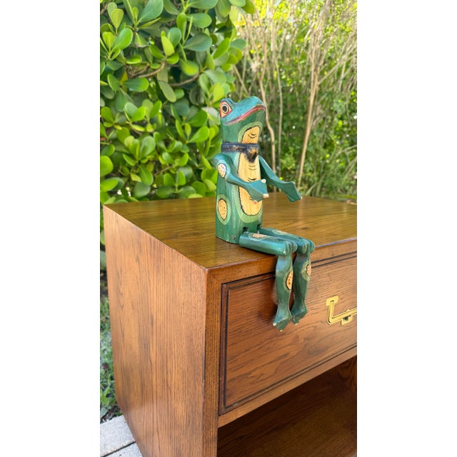 Vintage hand carved wooden frog figure featuring articulated limbs, hand-painted detailing, and a whimsical shelf sitter...