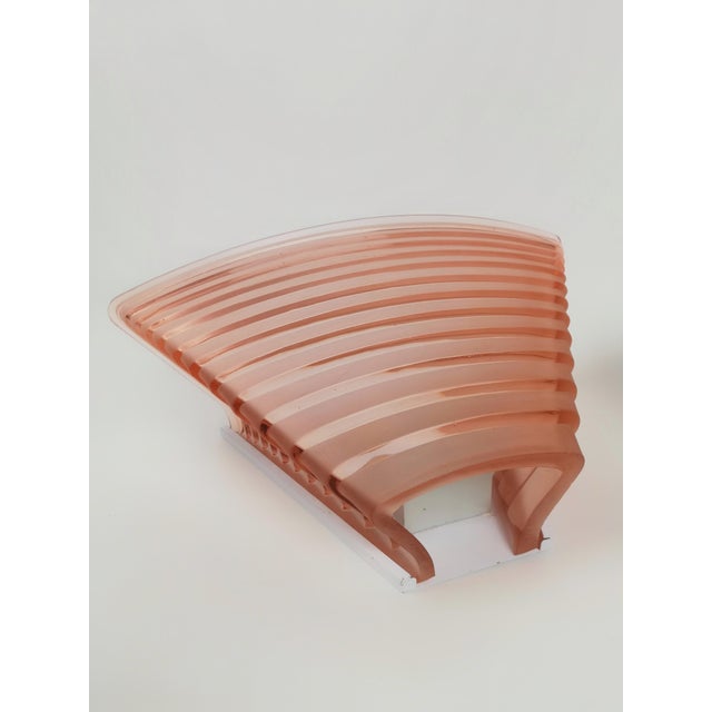 Pair of large wall sconces model "Pergamo 38" designed by Angelo Mangiarotti for Artemide during the 1980s. The design is...