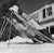 New England Skiing 1955 by Slim Aarons Slim Aarons Limited Estate Edition two women recline on improvised sunbeds in New...