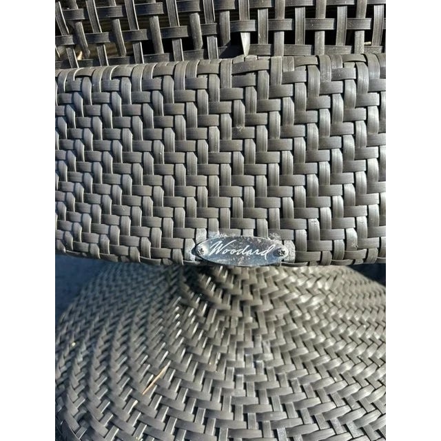 This set of 4 Woodard Woven Outdoor Swivel Chairs with Cushion is a stylish and modern addition to any outdoor space. The...