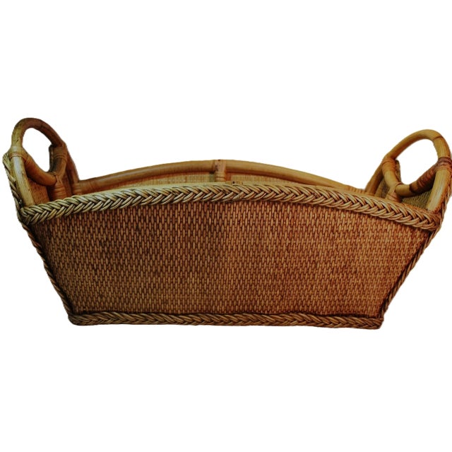 Vintage hand-made braided bamboo and rattan basket with handles. Handcrafted pieces exude a timeless charm and are perfect...