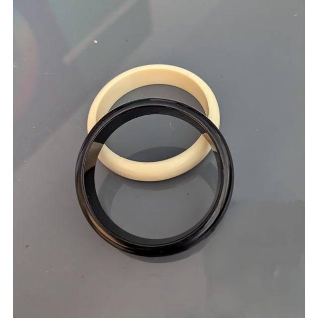 Two swanky black and white acrylic bangles.