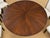 Elegant nine-piece dining set featuring a generously proportioned round 68" wide dining table with a rich, dark wood...