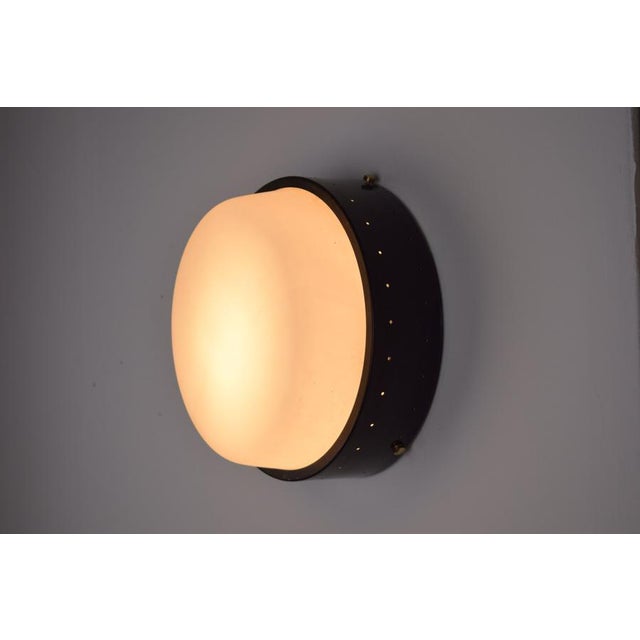 An elegant 1950s Italian ceiling light produced by Greco, a refined example of mid-century design. Crafted from painted...