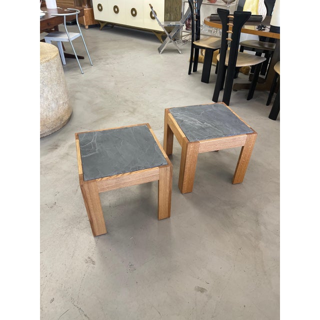 A pair of solid oak tables with slate inset tops. Beautiful graining to the oak sides. These are custom pieces newly made...