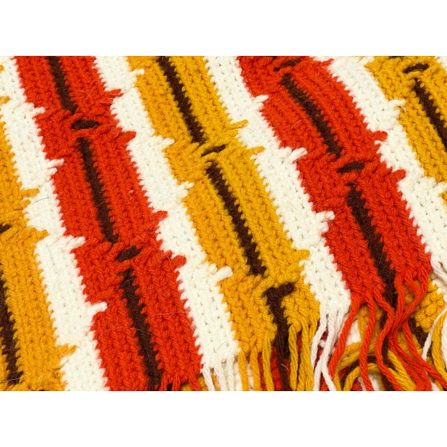 Add some warmth and color to any room with this vibrant, super retro hand made blanket. This needlework vintage beauty is...