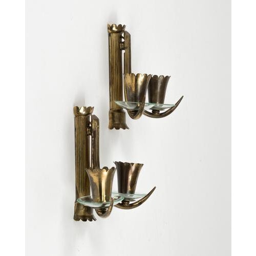 Midcentury beautiful pair of wall lamps in brass and glass in the style of Gio Ponti. Made in Italy in the 1950s. Up to...